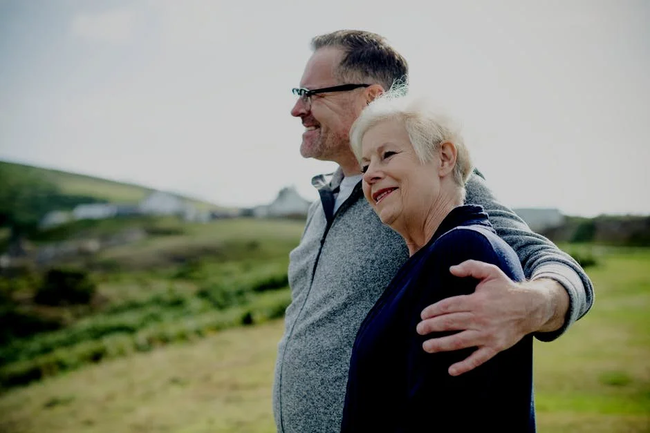 Older resident sharing a moment with a family member outdoors